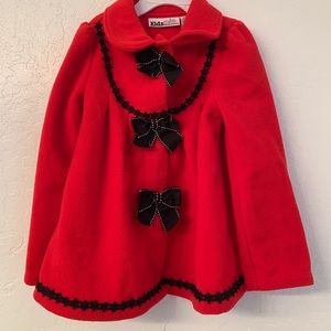 Red girl’s jacket with beautiful buttons